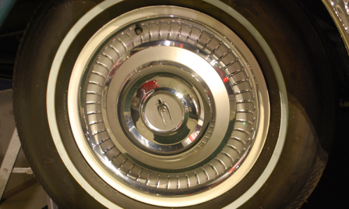 1966 Studebaker Daytona Sports Sedan hawk emblem hubcaps with thin whitewell 15 inch wheels.png