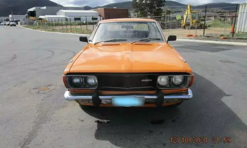 1974 Datsun 610 180B SSS orange hardtop coupe  front grille (8).png
