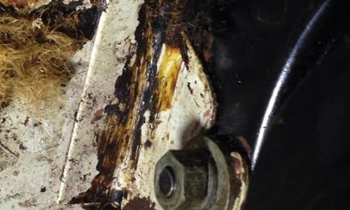 Bracket spot welded to firewall.jpg