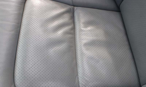C140 Mercedes coupe early perforated leather seat trim image close up.png