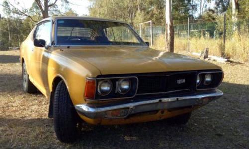 Datsun 180B SSS 610 hardtop coupe Mustard orange paint.jpg