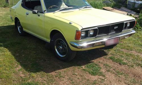 Datsun 180B SSS 610 hardtop coupe pale yellow paint.jpg