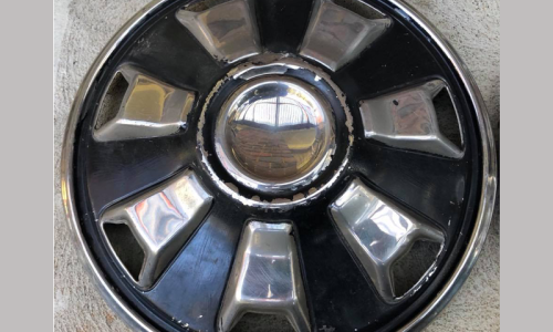 Datsun 180B SSS 7-slot stainless steel hubcap image.png