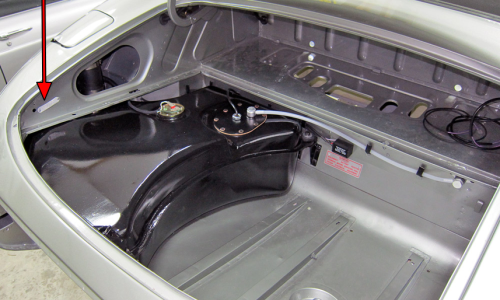 E-Type Jaguar Body number tag rear trunk boot above fuel tank.png