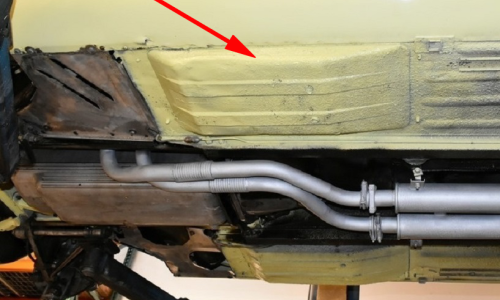 E-Type dished floor pans under car image.png