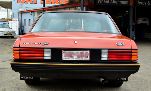Ford XE ESP Ghia rear chesnut on charcoal.png