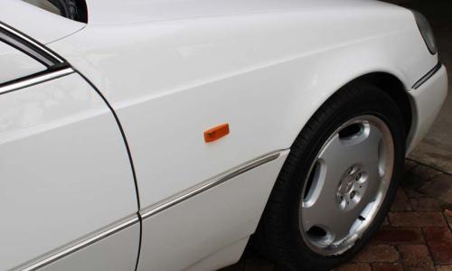 Front mudguard and amber indicator lens Mercedes C140.jpg