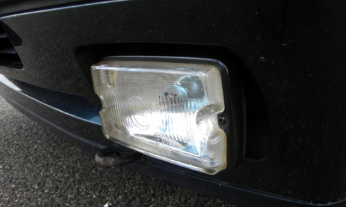 Peugeot 205 GTI Siemdriving lights clear lens up close.png