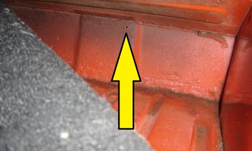 Plastic plug under rear seat for vapour pipe.jpg