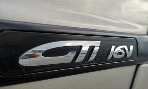 Rear quarter badge GTi 16v Proton Satria GTi badge rub strip image.png