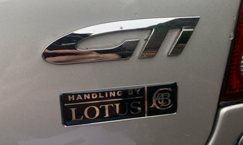 Satria GTi Rear badge early GTi Lotus badge.png