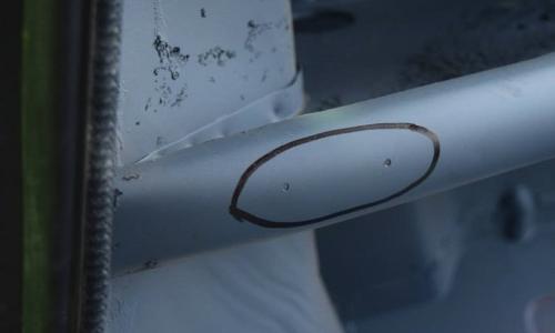 Serial number police holes in LHS dash.jpg