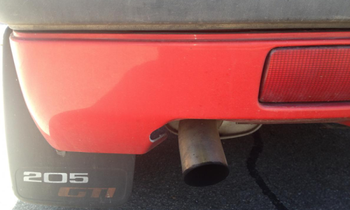 Stock exhaust and optional 205 GTI mudflaps.png