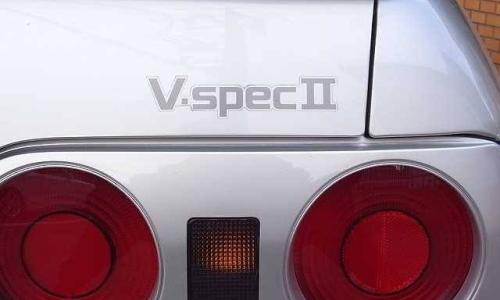 V spec badge on silver car.jpg