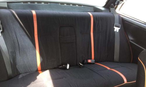 Volvo 242 GT rear seat trim black with red stripe.jpg