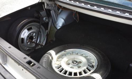 Volvo 242 GT trunk with space saver spare wheel.jpg