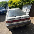 1989 Ford Telstar Turbo hatch white on grey (3).jpg