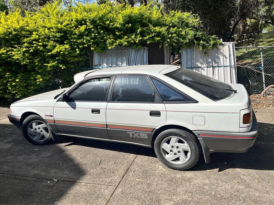 1989 Ford Telstar Turbo hatch white on grey (1).jpg
